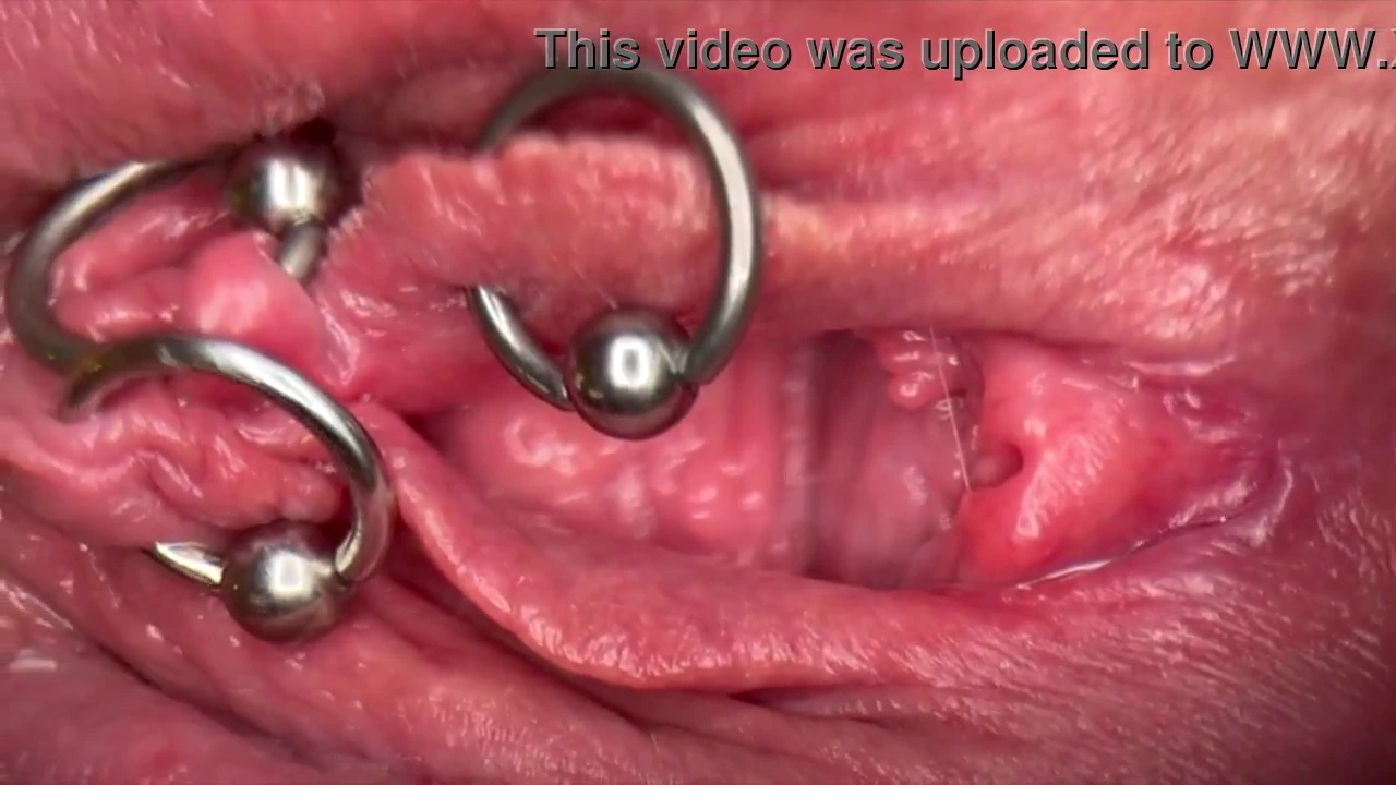 Get up close and personal with my pierced clit and wet pussy in this steamy POV. Watch as I piss right into the camera, creating an intimate and erotic experience.